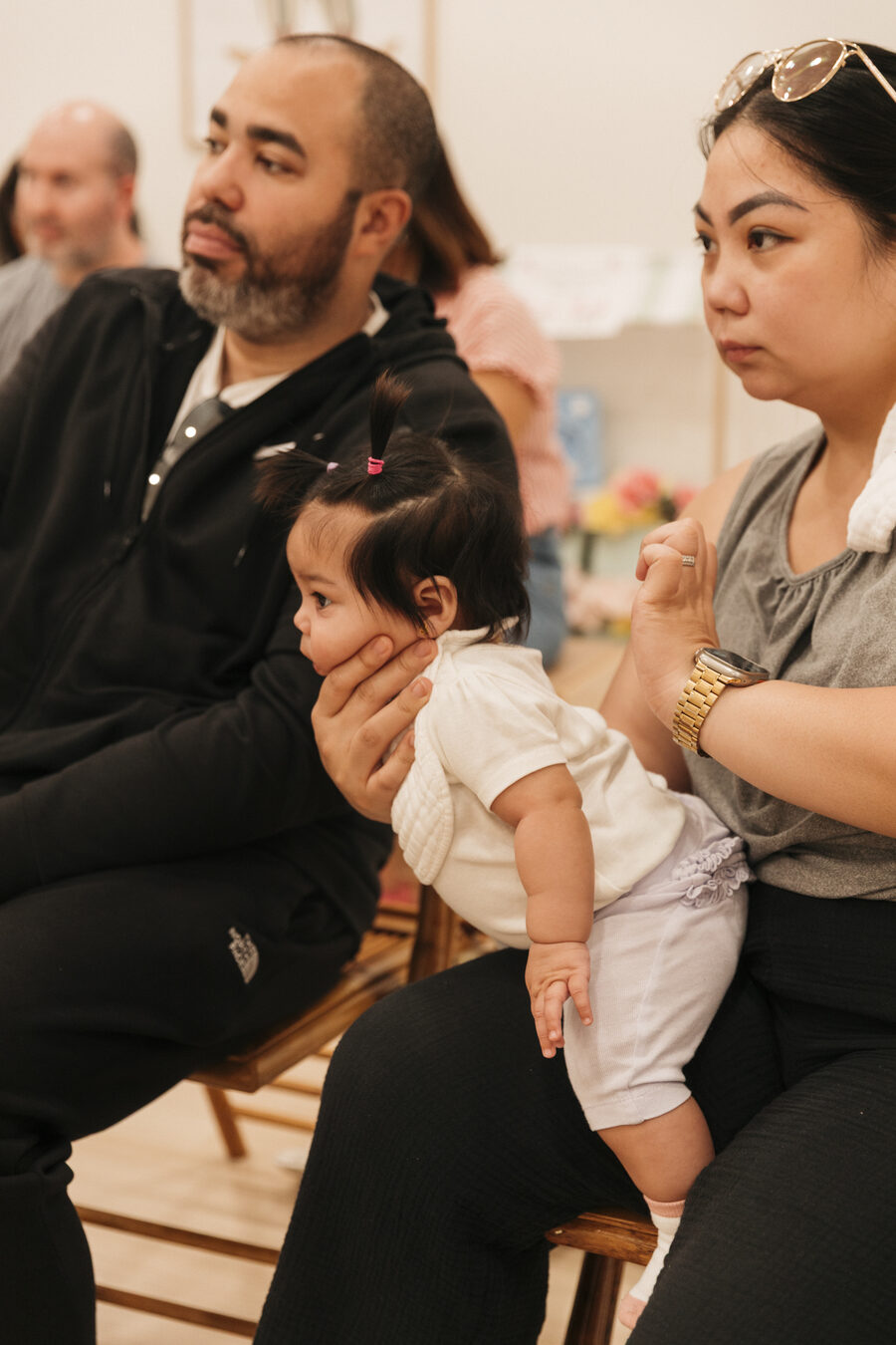 Parents attending an EXO workshop with their baby